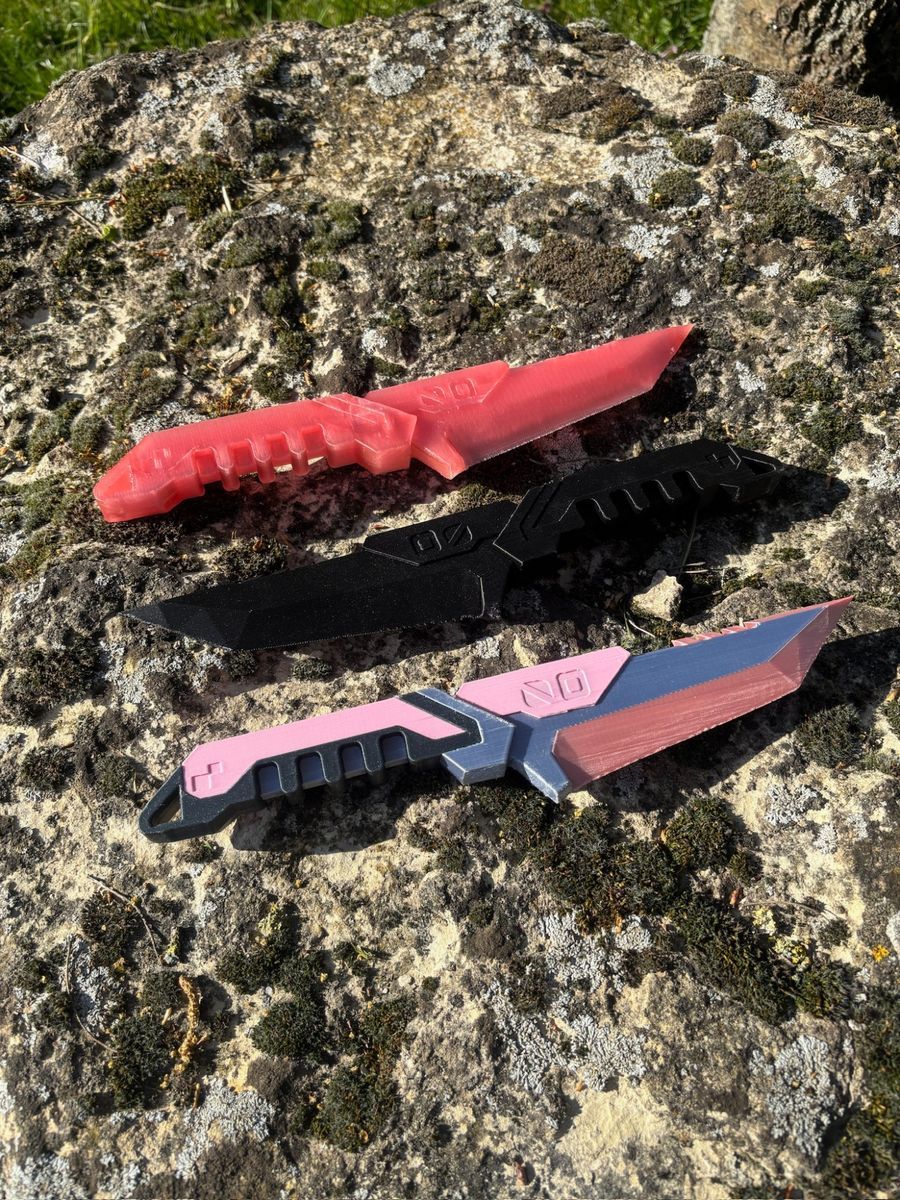 Three overlay daggers in different colours